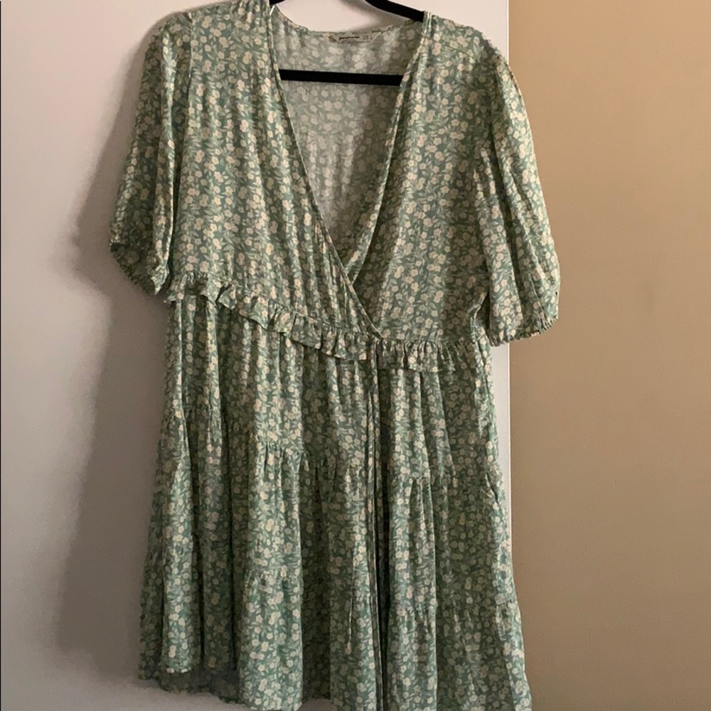 green floral dress with slight puff sleeves
